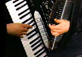 Nick Ariondo's hands on accordion.